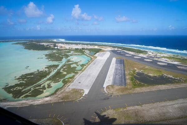 Taking off from Wake Island. The shadow of the aircraft lifting off is that of a C-17 Globemaster. Image courtesy of the US Air Force.