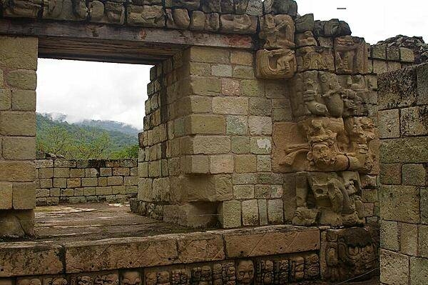 Entrance way with carvings at a Maya archaeological site at Copán in western Honduras. The site functioned as the political, civil and religious center of the Copán Valley and was composed of a main complex with several secondary complexes. Copán was declared a UNESCO World Heritage Site in 1980.