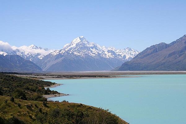 At 3,724 meters (12, 218 ft), Aoraki/Mount Cook on the South Island is the tallest peak in New Zealand and a favorite challenge for mountain climbers. The mountain is shown here overlooking Lake Pukaki, whose distinctive light blue color is caused by extremely finely ground glacial particles (glacial flour).