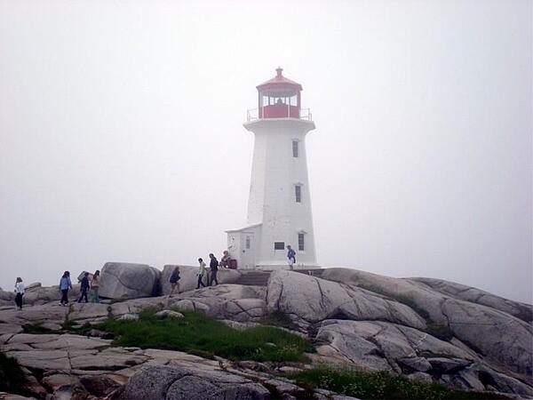 Peggys Point Lighthouse in Peggys Cove, Nova Scotia, Canada, is a popular tourist site operated by the Canadian Coast Guard. The lighthouse, the second one on this site, was built in 1914 and is 15 m (50 ft) tall.