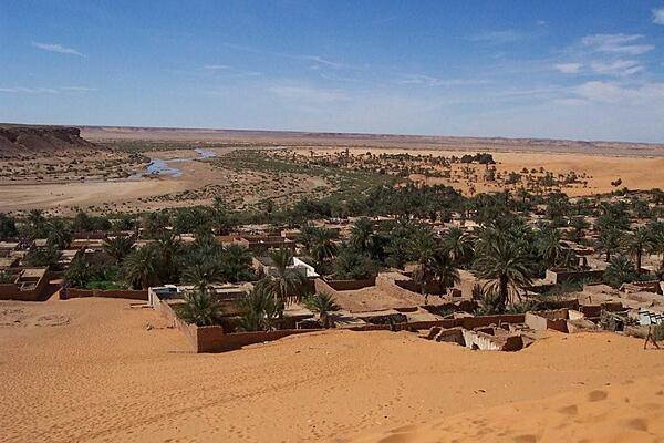 The oasis ksar (Amazigh village) of Beni Abbes, Algeria. The site was first inhabited in the 12th century by a tribe from Mauritania. The town today has an old part made up of semi-attached houses, granaries, mosques, baths, ovens, and shops, and a new part with a research center composed of a museum, zoo, and botanical garden. The old part has been largely uninhabited for decades, but enough remains to give a good representation of traditional desert architecture.