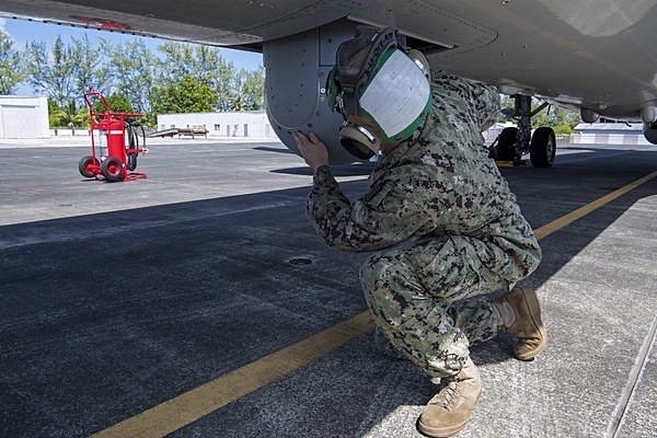 A crew member from US Navy Patrol Squadron (VP) 45, inspects a sensor on a Boeing P-8 Poseidon aircraft onboard US Navy Support Facility (NSF) Diego Garcia in the British Indian Ocean Territory. Photo courtesy of the US Navy/ Mass Communication Specialist 3rd Class Jillian F. Grady.