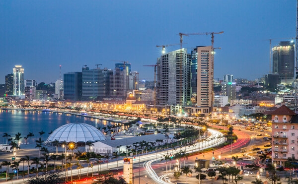 Luanda Marginal or the Avenida 4 de Fevereiro (Avenue of the Fourth of February) at night. The Marginal is an elevated scenic 5.5 km (3.4 mi) route running parallel to Luanda Bay in Angola.