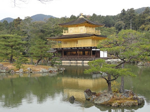 Kinkaku-ji  or "Temple of the Golden Pavilion,"  is a Zen Buddhist temple in Kyoto and one of the most popular buildings in the country, attracting thousands of visitors annually. Designated as a National Special Historic Site and a National Special Landscape, it is one of 17 locations making up the Historic Monuments of Ancient Kyoto that are World Heritage Sites.