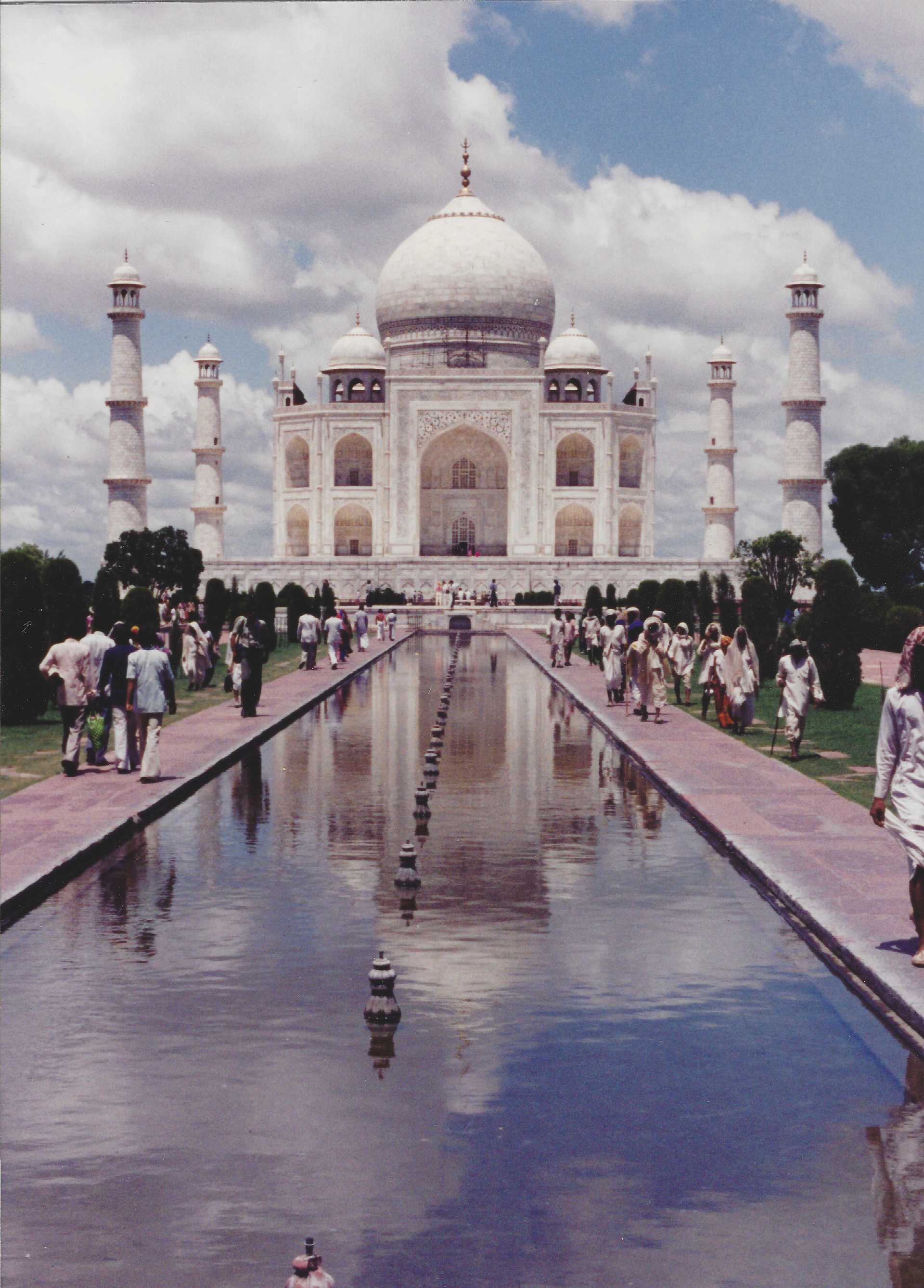 The Taj Mahal's reflecting pool is flanked by cypress trees and provides a reflection of the mausoleum. The marble tomb complex in Agra, India, was constructed in the 17th century by Emperor Shah Jahan in homage to his favorite wife Mumtaz Mahal.