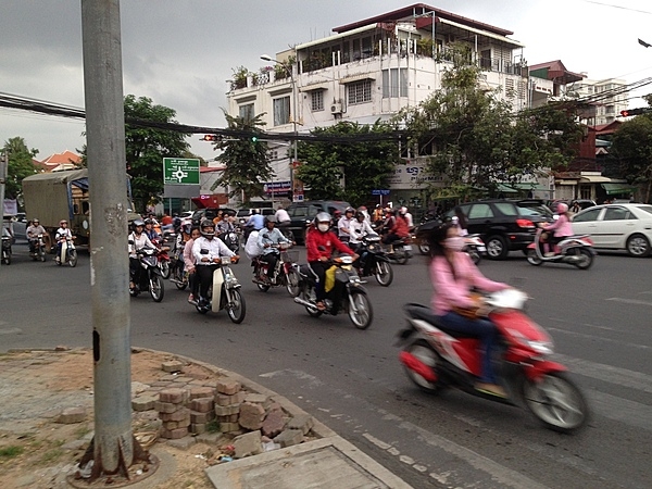 Busy street in Phnom Penh, Cambodia, where motorcycles are a very common form of transportation.