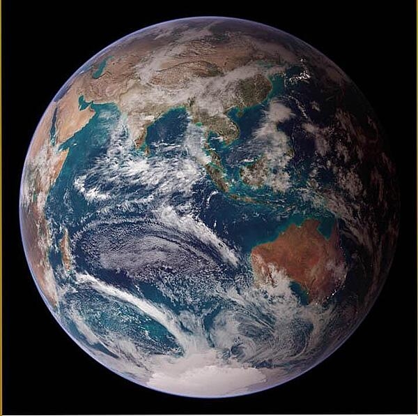 This "blue marble" image of the globe merges data from multiple satellite missions (not all collected at the same time). The focus in this view is the Indian Ocean and its surrounding land masses. Notice the city lights on the night side of the globe, in Japan in the north and in eastern Australia in the south. Image courtesy of NASA.