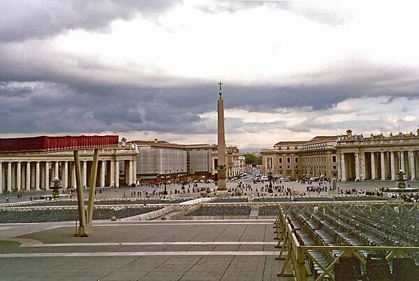 Looking past the obelisk that stands at the center of St. Peter's Square in the Vatican, out to the city of Rome, Italy.