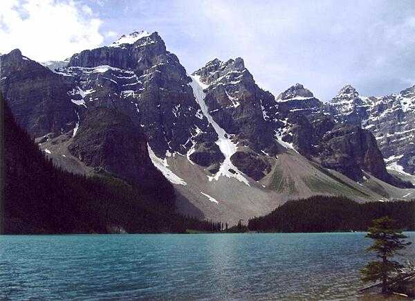 Moraine Lake in Banff National Park, Alberta, Canada. The intense blue waters of the lake come from the run-off of nearby glaciers.