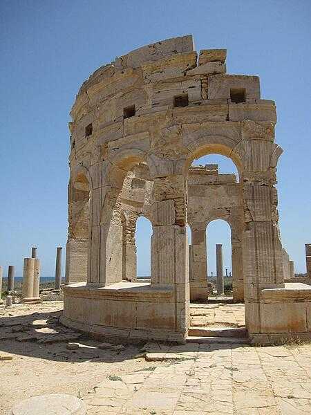 Leptis Magna, about 100 km (60 mi) east of Tripoli, is recognized as one of the most complete and best-preserved Roman ruins in the Mediterranean area. Founded as a Phoenician settlement in the second half of the 7th century B.C., Leptis was gradually absorbed into the Roman Empire and achieved its greatest prominence in the late 2nd-early-3rd centuries A.D., as the hometown of Emperor Septimius Severus. Septimius lavished honors on the city, including the creation of a magnificent new forum and the rebuilding of the docks, and made Leptis Magna the third-most important city in Africa, rivaling Carthage and Alexandria. The photo shows the remains of the Leptis market building (macellum). Leptis Magna became a UNESCO World Heritage site in 1982.