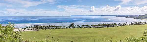 Panoramic view of Asan Bay and part of the War in the Pacific National Historical Park. In July 1944, Asan Bay was the site of  the northern invasion landing area on the west coast of Guam. The 3rd Marine Division landed in this area with an objective of seizing the high ground behind the beach area. Photo courtesy of the US National Park Service.