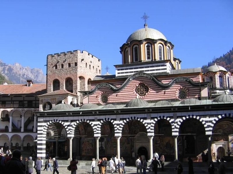 The Rila Monastery is the largest and most famous Eastern Orthodox monastery in Bulgaria. Founded in the 10th century by Saint John of Rila, it is regarded as one of Bulgaria's most important cultural, historical, and architectural monuments and is featured on the reverse of the one-lev banknote. The monastery is located in the southwestern Rila Mountains, 117 km (73 mi) south of the capital Sofia, in the Rila Monastery Nature Park along the Rilska River.