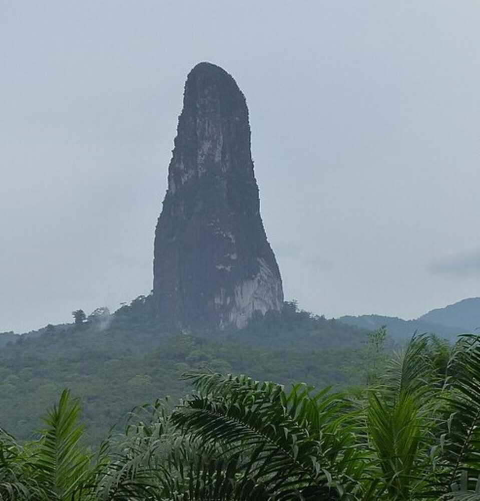 Sao Tome and Principe's most famous landmark is the Pico Cão Grande (Portuguese for "Great Dog Peak"), a needle-shaped volcanic plug peak in the Obo National Park. The volcanic plug was formed three and a half million years ago when magma solidified in the vent of an active volcano.