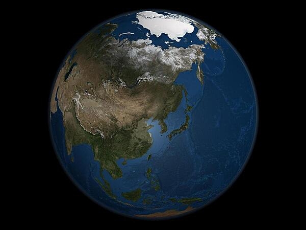 A global view of Asia on September 21,  2005, the day when Arctic Sea ice was at its minimum extent for the year. Land areas display the average seasonal landcover from September 2004.  Image courtesy of NASA.