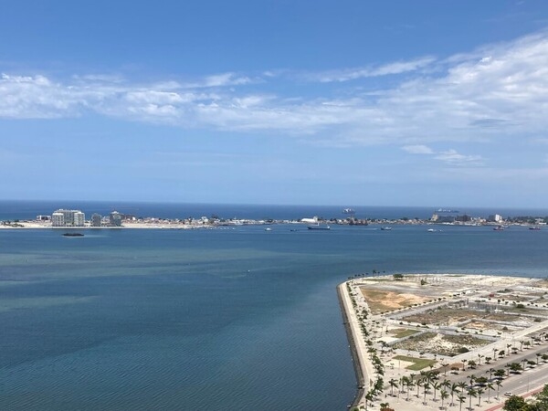 The Marginal in Luanda, Angola, has many scenic views of the ocean and the city, and this view shows the Ilha de Luanda (Island of Luanda) in the distance.