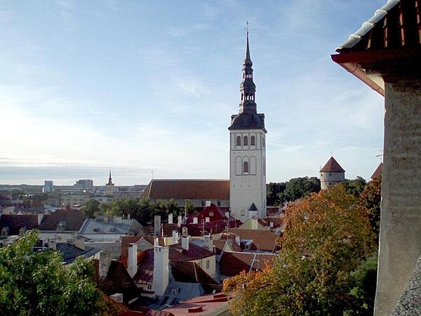 Rooftop view of the lower town of Tallinn, Estonia, as seen from the upper town. The prominent church is that of Saint Nicholas, originally built in the 13th century. Partially destroyed by Soviet bombing during World War II, the church was restored and is today used as an art museum and concert hall.