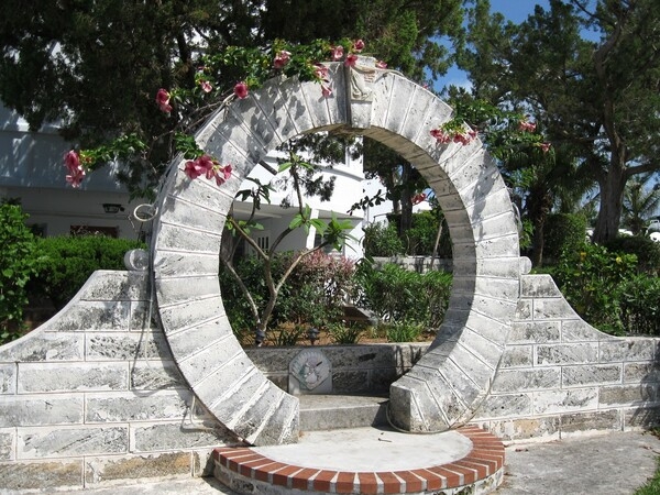 An iconic symbol of Bermuda are its moon gates, which trace their roots back to China. In 1860, a local sea captain visited a Chinese garden and returned to the island with plans to build one. The structures are believed to bring good luck, prosperity, and joy to those who pass under them and make a wish. Today there are 40 moon gates across the island, many of which are accessible to visitors.