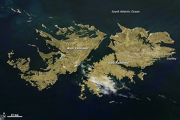 The Falkland Islands lie about 600 km (400 mi) east of Argentina and 1,350 km (850 mi) north of the Antarctic Circle. Shown here are the two largest islands -- East Falkland and West Falkland. Farmers often burn pastureland in the early spring to encourage growth, and this satellite image shows a few agricultural fires west of Stanley. Image courtesy of NASA.