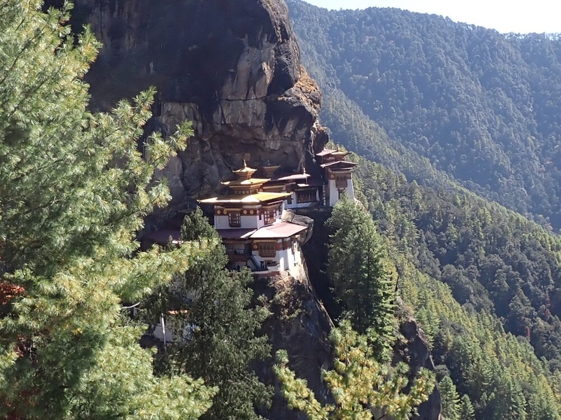 The Tiger’s Nest Monastery (Taktshang Goemba), Bhutan’s most famous monastery, is built on the side of a cliff 2,950 m (9,678 ft) above the Paro Valley. According to a legend, the Guru Rinpoche (the second Buddha) founded the monastery after flying from Tibet to Bhutan on the back of a tigress to subdue a demon, Singye Samdrup, who was troubling the valley’s resident. The first monastery was built in 1692, but due to fires and age, the structure was rebuilt numerous times, most recently in 2005 to repair damage from a fire in 1998.