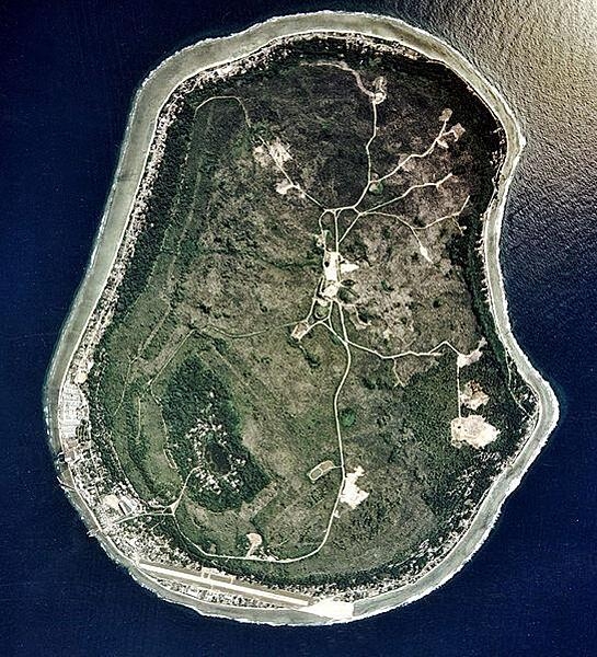 Satellite photo of Nauru vividly displays some of the prominent features of the island including roadways, the landing strip of the international airport in the south, and the Buada Lagoon in the southwest.
Nauru holds the distinction of being the third-smallest country in the world, the smallest country in the Pacific Ocean, the smallest country outside of Europe, the world's smallest island country, and the world's smallest independent republic.  Located 53 km (32 m) south of the Equator, Nauru is one of the three great phosphate rock islands in the Pacific Ocean. Image courtesy of the US Department of Energy's Atmospheric Radiation Measurement Program.