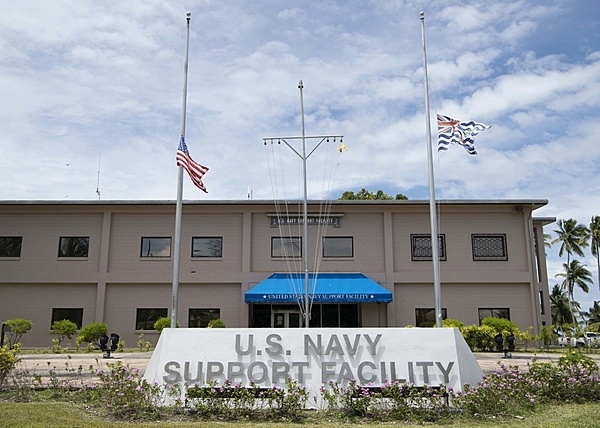 The main administration building for US Navy Support Facility (NSF) Diego Garcia. The US and British Indian Ocean Territory flags are flown at half-mast on September 11 to mark an anniversary of the terrorist attacks on the US. NSF Diego Garcia provides logistic, service, recreational, and administrative support to US and Allied Forces forward deployed to the Indian Ocean and Arabian Gulf. Photo courtesy of US Navy/ Mass Communication Specialist 2nd Class Charlotte C. Oliver.