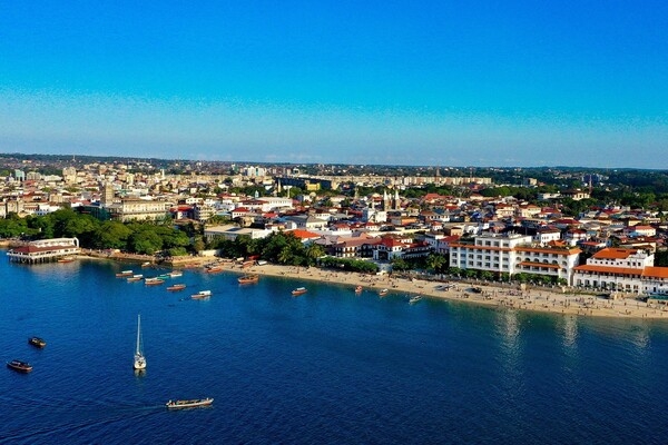 A view of Zanzibar, a semi-autonomous state that united with Tanganyika in 1964 to form the United Republic of Tanzania. This archipelago in the Indian Ocean consists of many small islands with the two largest being Zanzibar and Pemba Island. The Zanzibar archipelago is often referred to as the “Spice Islands” for its production of cloves, nutmeg, cinnamon, and black pepper. The historic center is Stone Town, the world’s oldest functioning Swahili city and a UNESCO World Heritage site since 2000.