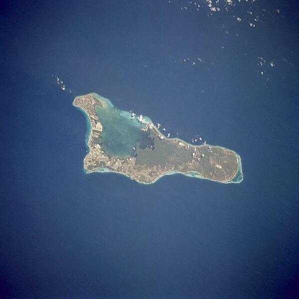 Grand Cayman is a low-lying, limestone island located on top of a submarine ridge. The city of George Town, the capital and chief port of the Cayman Islands, may be seen at the southwest end of the island. Grand Cayman's seven-mile beach is on the western side of the island. Image courtesy of NASA.