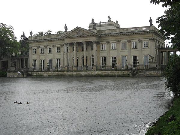 The Palac na Wodzie (Palace on the Water) located in the Park Lazienkowsi (Royal Baths Park) in Warsaw) - the largest park in Warsaw. Built in the 17th century, the structure was remodeled in the 18th century and became a royal residence.  The palace stands on an artificial island in Lazienki Lake, which it divides in two. The building is connected to the rest of the park by two arcaded bridges.