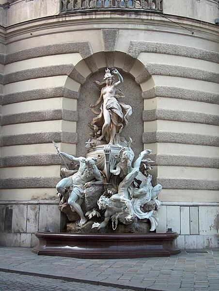 The "Power at Sea" fountain, one of two that grace the front of the Michaelertrakt (Michael&apos;s Wing) of the Hofburg (Imperial Palace) in Vienna, Austria.