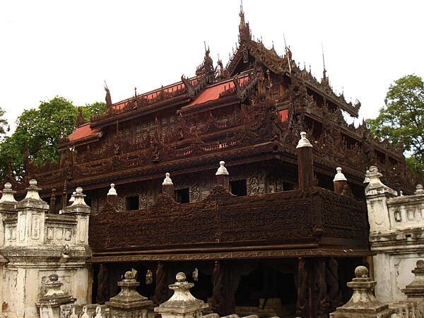 The Shwenandaw Kyaung Temple, built in traditional Burmese architectural style, is the only remaining structure from the original Royal Palace in Amarapura, Burma. The temple was later moved to nearby Mandalay where is remains today. After King Mindo died in the building in 1878, it was converted into a monastery dedicated to his memory. The monastery is known for its teak carvings of Buddhist myths adorning the walls and roof.