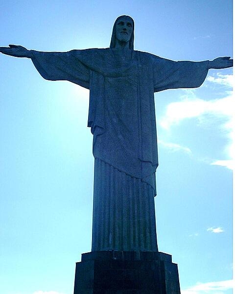 The Christ the Redeemer statue in Rio de Janeiro, Brazil, stands 30 m (98 ft) tall and has outstretched arms spanning 28 m (92 ft). It was constructed between 1922 and 1931 on Mount Corcovado, in celebration of the centenary of Brazilian independence. The largest Art Deco-style statue in the world, it is made from reinforced concrete and covered with thousands of triangular soapstone tiles. The statue became a UNESCO World Heritage Site in 1973 and was voted one of the New Seven Wonders of the World in 2007.