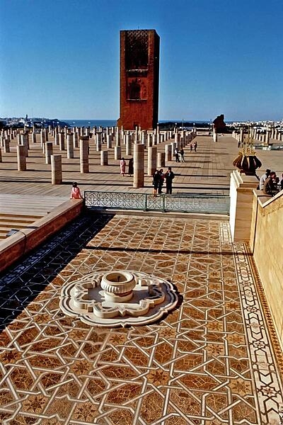 The Hassan Tower and the remains of a mosque that lie adjacent to the Mausoleum of Mohammed V in Rabat. The tower (44 m, 145 ft) is an incomplete minaret that was meant to be the the tallest in the world and to flank the world&apos;s largest mosque. Begun in 1195, construction was halted four years later when the sultan who commissioned the project died.