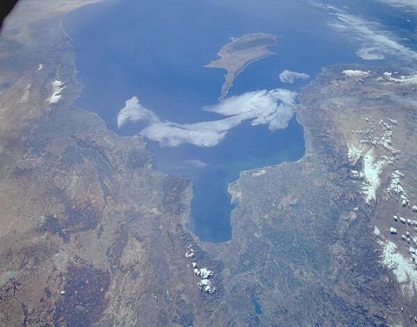 A southwest-looking astronaut photograph of south-central Turkey and northwest Syria. The coastlines of Syria, Lebanon, and Israel are visible along the eastern Mediterranean Sea. The island of Cyprus can be seen off the Turkish and Syrian coasts. Photo courtesy of NASA.