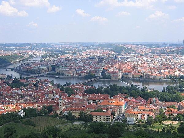 A view of Prague, Czechia, as seen from Castle Hill. The famous Charles Bridge over the Vltava (Moldau) River may be seen in the center of the image.