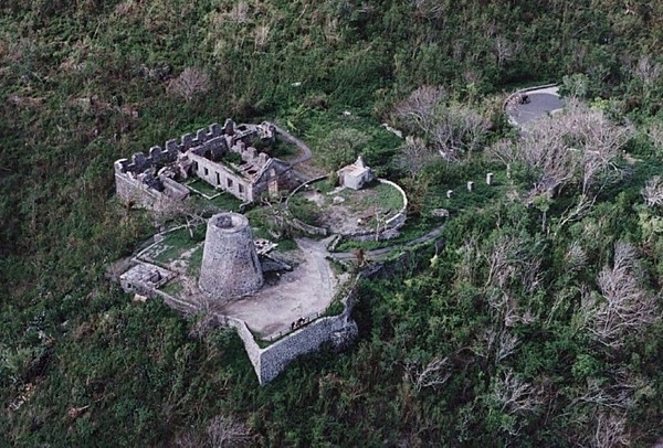 Aerial view of Annaberg Plantation. By 1780, the plantation was one of 25 active sugar producing factories on St. John. Other products produced at Annaberg were molasses and rum. Slave labor was used to clear densely forested hillsides and to terrace the slopes around Annaberg to make farming possible. Slave labor was also used to plant, harvest, and process the sugarcane. Today the plantation ruins are protected by the Virgin Islands National Park and are open to the public. Trees have once again claimed the hillsides around Annaberg. Photo courtesy of the US National Park Service.