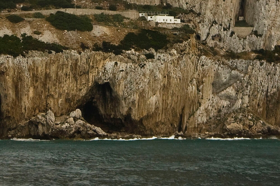 Gorham's Cave Complex is located in steep limestone cliffs on the eastern side of the Rock of Gibraltar. The complex includes four caves – named Vanguard, Hyaena, Bennett, and Gorham – that are believed to be one of the last habitations of Neanderthals in Europe. The complex is named after British Captain A. Gorham of the British Army�’s 2nd Battalion Royal Munster Fusiliers, who discovered it in 1907.