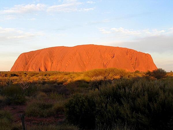 Uluru/Ayers Rock is an inselberg, or island mountain, found in the Northern Territory near Alice Springs,  in the middle of Australia's Outback.  It is a large sandstone rock formation that the aborigines of the area hold sacred.