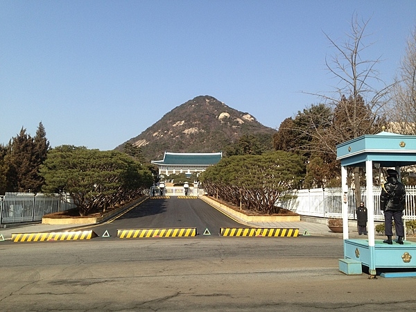 Entrance way to Cheongwadae or the Blue House (literally "pavilion of blue tiles”), the former executive office and official residence of the president of the Republic of Korea. In May of 2022, the president of South Korea moved his residence to the Ministry of National Defense Building in Seoul.  Cheongwadae and its grounds were converted into a public park and opened to visitors for the first time in the country's history.