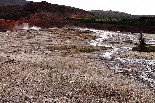 A geyser field and stream runoff in Iceland.