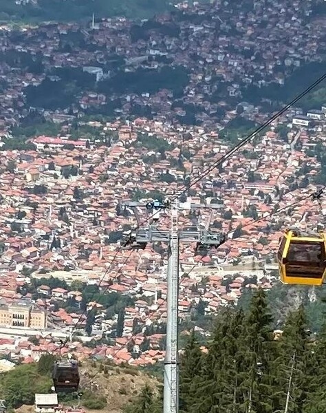 A view of Sarajevo from one of the cable cars that connects the old section of the city with Trebevic Mountain. The original cable car system was built and opened in 1959 but was completely destroyed during the Bosnian War (1992-95). In 2018, the Trebevic Cable Car was officially re-opened as a modernized, faster, and larger system, still crossing the border between the Federation of Bosnia and Herzegovina and the Republika Srpska.