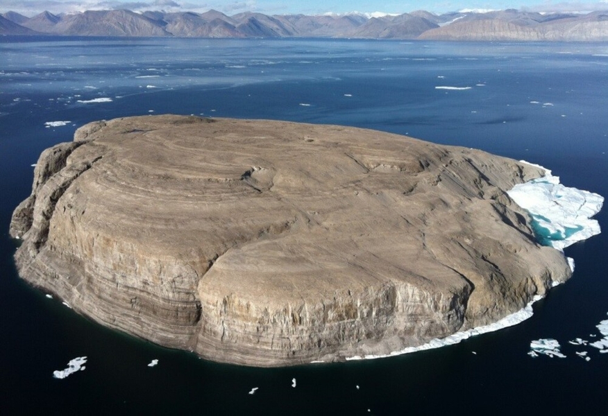 Hans Island, an uninhabited island located between Canada’s Ellesmere Island and Greenland (an autonomous territory of Denmark), was the center of a “whiskey war” between Canada and Denmark from 1984 to 2022. The island was named for Greenlandic Inuk explorer Hans Hendrik, who was part of the 1853 expedition that established Denmark’s claim to the barren 130 h (320 acre) island. Canada operated a scientific station there during World War II, and a Canadian oil company later operated nearby. In 1984, the Danish prime minister planted a flag on the island, prompting the Canadians to plant their flag – and leave a bottle of whiskey for the Danes. The Danes reciprocated with a flag-raising and a bottle of schnapps for the Canadians. This “war” lasted until an agreement in 2022 that split the island in half was sealed with a final exchange of spirits.