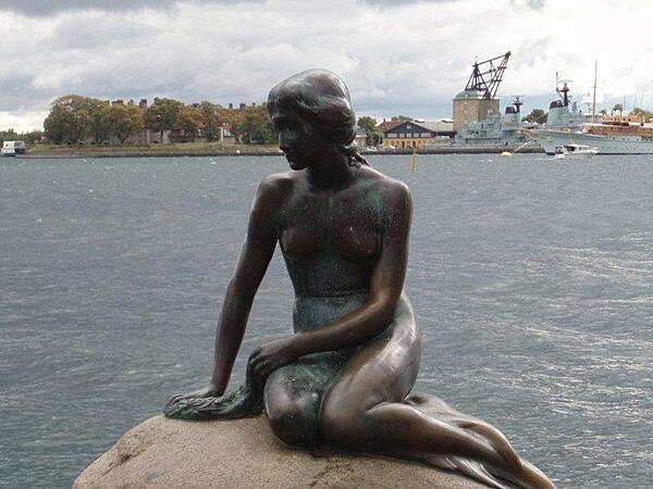 The Little Mermaid statue in Copenhagen Harbor has been a symbol of Copenhagen, Denmark, since 1913. Based on the fairy tale of the same name by Danish author Hans Christian Andersen, the small, unimposing bronze statue has been damaged or defaced many times in the past half-century, but has always been restored.