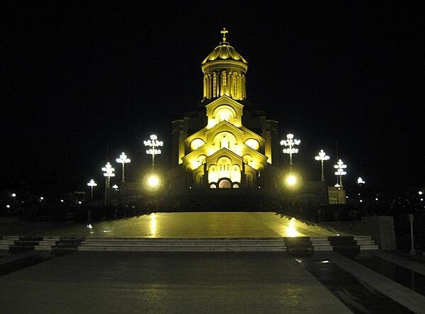 The Sameba (Holy Trinity) Cathedral  in Tbilisi, Georgia, is the main Georgian Orthodox Christian cathedral. It was built between 1995 and 2004 as a symbol of Georgian national and spiritual revival. The cathedral, located on the left bank of the Mtkvari River in Old Tbilisi, is cruciform and contains nine chapels.