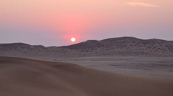 The Namib Desert, for which Namibia is named, is a cool coastal desert running 1,900 km (1,200 mi) along Africa’s Atlantic coast, through Angola, Namibia, and South Africa. The name “Namib” is derived from the Nama language and means “an area where there is nothing.” Considered the oldest desert in the world, the Namib is home to important tungsten, salt, and diamond mines. The 49,768 sq km (19,215 mi) Namib-Naukluft National Park, which is also located in the Namib, is the largest game park in Africa and one of the largest in the world. Namibia was the first country to incorporate environmental protection into its constitution, with some 14% of its land protected, including most of its share of the Namib Desert.