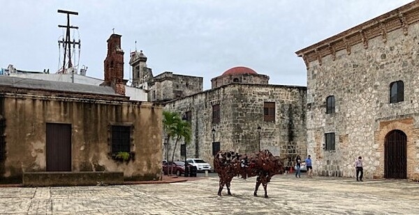 The Museo de las Casas Reales (Museum of the Royal Houses), on the right, is a part of the Colonial City of Santo Domingo, Dominican Republic. The building was constructed between 1505 and 1511 as the Palace of the Viceroy of Santo Domingo; in 1973, it became a national museum, housing collections dating back to the Spanish colonial era.