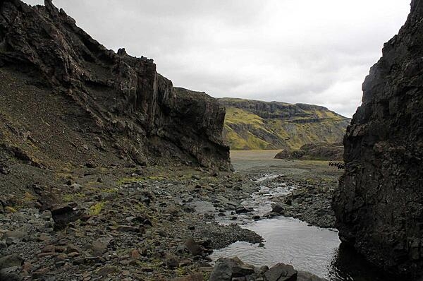 Mini stream between banks of eroding basalt in Iceland's Thingvellir National Park.