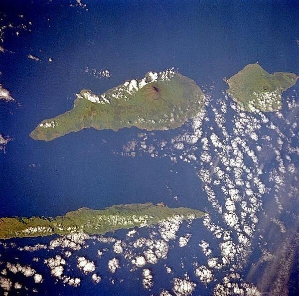 Three islands of the central Azores -- spear-shaped Sao Jorge Island, Pico Island with its large volcano, and circular volcanic Faial Island -- are visible in this low-oblique, southwest-looking, space shuttle photograph. Image courtesy of NASA.