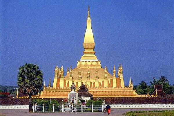 Pha That Luang, the Great Stupa in Vientiane, considered a national symbol of Laos includes many references to Lao culture and identity in its architecture.  It was built in the 16th century on the ruins of a 13th century Khmer temple, which in turn was built on the ruins of a 3rd century Indian temple built by Buddhist missionaries. The gold-covered stupa stands 45 m (148 ft) high and is said to contain a relic of the Buddha.