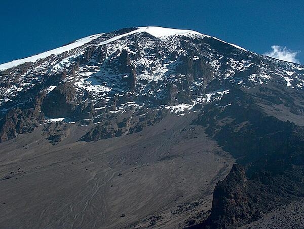 Mount Kilimanjaro in Tanzania is Africa’s highest mountain and the world’s tallest freestanding volcano at 5,895 m (19,341 ft) high. The origin of its name may be a combination of the Swahili word kilima, meaning “mountain,” and the KiChagga word njaro, loosely translated as “whiteness,” giving it the name “White Mountain.” A popular spot for tourists, Mount Kilimanjaro became a UNESCO World Heritage Site in 1987 and was named one of the Seven Natural Wonders of Africa in 2013.