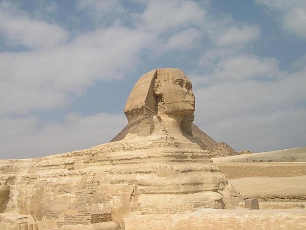 The Great Sphinx, a reclining lion with a human head, is the oldest known monumental sculpture in the world. It is believed to have been carved around 2500 B.C. and probably depicts the Pharaoh Khafre.